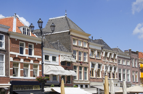 Historic houses on the central town square of Delft , Holland